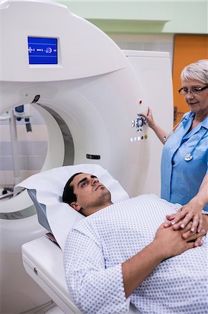 Patient entering mri scan machine at hospital Stock Photo - Premium Royalty-Free, Code: 6109-08720149