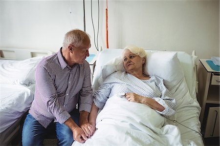 simsearch:6109-08689528,k - Senior man consoling senior woman in hospital Stock Photo - Premium Royalty-Free, Code: 6109-08720283