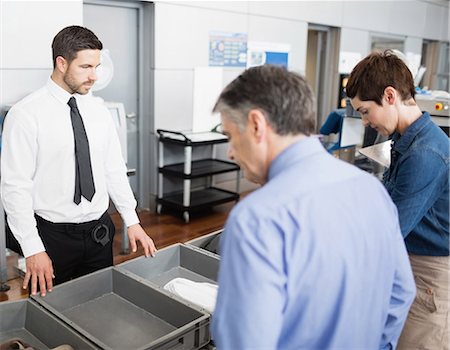 simsearch:6102-07843643,k - Passengers in security check at airport Photographie de stock - Premium Libres de Droits, Code: 6109-08722586