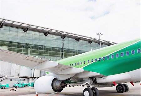 simsearch:6109-08722686,k - Airplane with loading bridge getting ready for departure at airport terminal Stock Photo - Premium Royalty-Free, Code: 6109-08722690