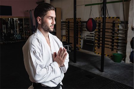 simsearch:6109-08739244,k - Man practicing karate in fitness studio Photographie de stock - Premium Libres de Droits, Code: 6109-08739206