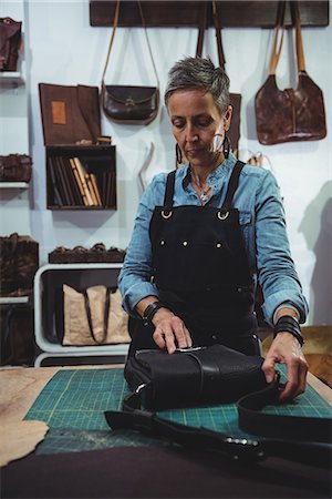 simsearch:614-08821252,k - Attentive craftswoman working in workshop Stock Photo - Premium Royalty-Free, Code: 6109-08802324