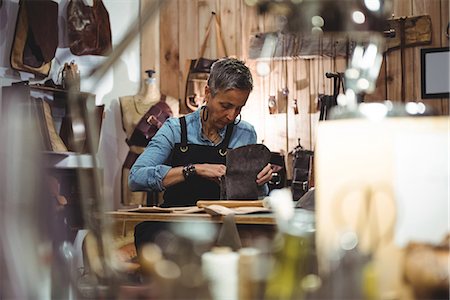 simsearch:614-08821252,k - Attentive craftswoman working in workshop Stock Photo - Premium Royalty-Free, Code: 6109-08802330