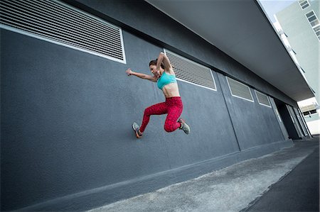 person leaping city - Women practising parkour on the street Stock Photo - Premium Royalty-Free, Code: 6109-08803077