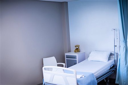 simsearch:6109-08689539,k - View of empty hospital bed in ward of hospital Stock Photo - Premium Royalty-Free, Code: 6109-08803207