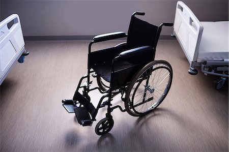 simsearch:6109-08689539,k - Empty wheelchair in ward at hospital Stock Photo - Premium Royalty-Free, Code: 6109-08803204