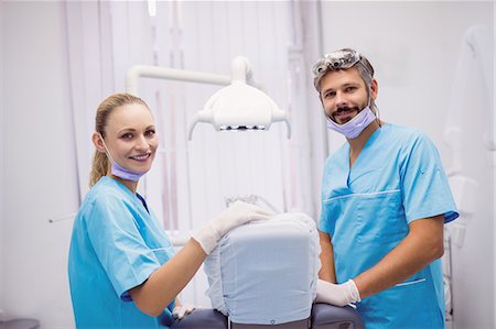 dentist and dental assistant relationship - Portrait of dentist smiling at camera at dental clinic Stock Photo - Premium Royalty-Free, Code: 6109-08803957