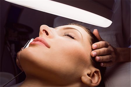 simsearch:6109-08804147,k - Dermatologist performing laser hair removal on patient face in clinic Stock Photo - Premium Royalty-Free, Code: 6109-08804020