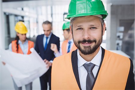 simsearch:614-06814032,k - Portrait of a confident architect smiling Stock Photo - Premium Royalty-Free, Code: 6109-08804265