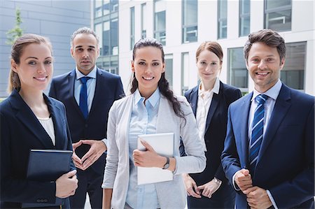 simsearch:6109-08804469,k - Portrait of confident businesspeople standing outside office building Stock Photo - Premium Royalty-Free, Code: 6109-08804214