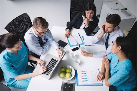 simsearch:6109-06006486,k - Team of doctors in a meeting at conference room Stock Photo - Premium Royalty-Free, Code: 6109-08804393