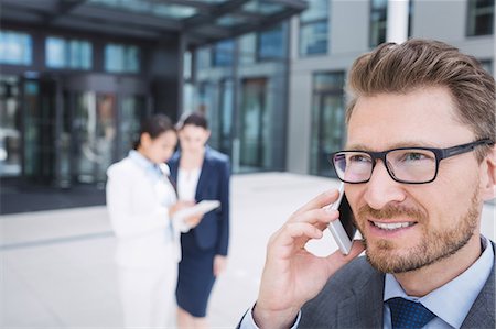 simsearch:6109-08763979,k - Confident businessman talking on mobile phone Stock Photo - Premium Royalty-Free, Code: 6109-08804306