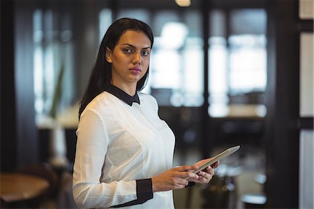 desplazar texto - Businesswoman using digital tablet in office Foto de stock - Sin royalties Premium, Código: 6109-08805139