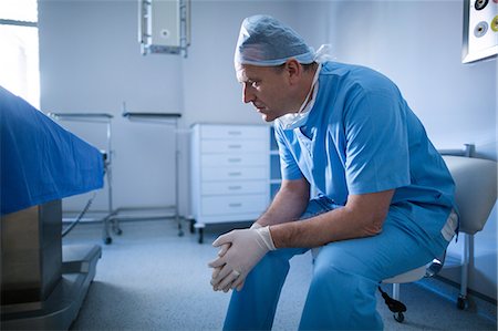 simsearch:400-07334526,k - Male surgeon sitting on a chair Stock Photo - Premium Royalty-Free, Code: 6109-08829991