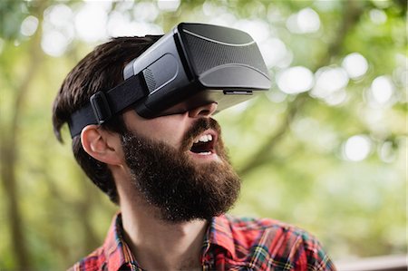 Man using virtual reality headset Photographie de stock - Premium Libres de Droits, Code: 6109-08829930