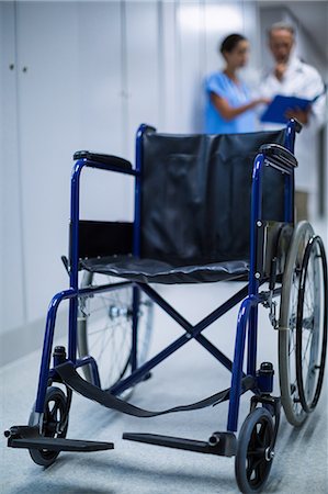 simsearch:6109-08689539,k - Wheelchair in hospital corridor Stock Photo - Premium Royalty-Free, Code: 6109-08830014