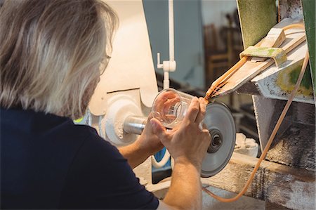 Glassblower polishing and grinding a glassware Stock Photo - Premium Royalty-Free, Code: 6109-08830266