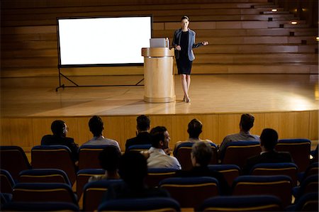 simsearch:6109-08830504,k - Female business executive giving a speech Stock Photo - Premium Royalty-Free, Code: 6109-08830476