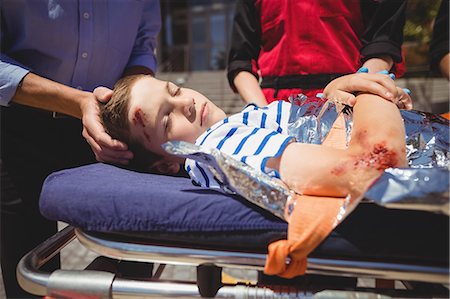 sick boy - Paramedics rushing a patient in emergency Stock Photo - Premium Royalty-Free, Code: 6109-08830418