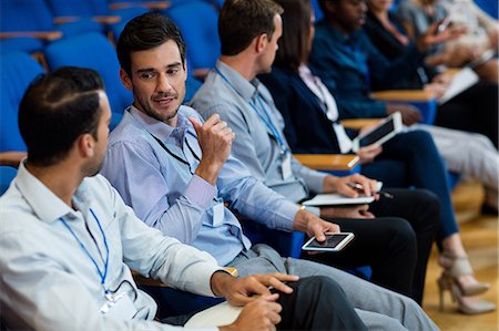 simsearch:6109-08830505,k - Business executives participating in a business meeting Stock Photo - Premium Royalty-Free, Code: 6109-08830510