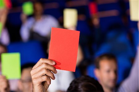 Business executives show their approval by raising hands Stock Photo - Premium Royalty-Free, Code: 6109-08830531