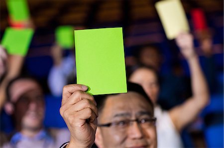 participant - Business executives show their approval by raising hands Photographie de stock - Premium Libres de Droits, Code: 6109-08830532