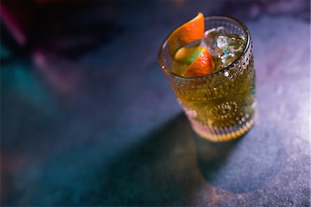 fruit drink shop - Close up of orange cocktail in glass at counter in bar Stock Photo - Premium Royalty-Free, Code: 6109-08944483