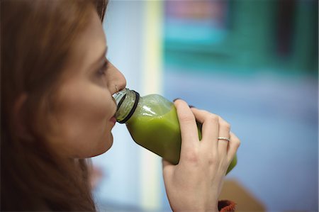 simsearch:649-07119030,k - Close-up of woman drinking health drink in the restaurant Stock Photo - Premium Royalty-Free, Code: 6109-08944429