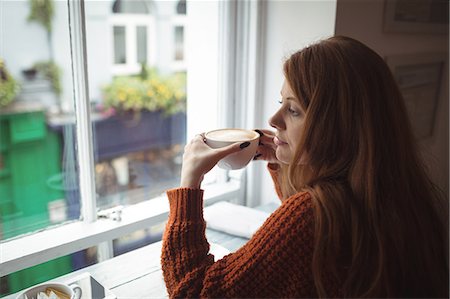 simsearch:6109-07496970,k - Beautiful woman having coffee at window in the restaurant Fotografie stock - Premium Royalty-Free, Codice: 6109-08944436