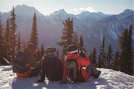 simsearch:6109-08944908,k - Three skiers relaxing on snow mountain during winter Stock Photo - Premium Royalty-Free, Code: 6109-08944918