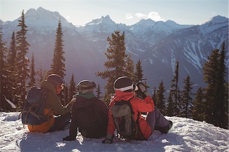 simsearch:6109-06195607,k - Three skiers relaxing on snow mountain during winter Photographie de stock - Premium Libres de Droits, Code: 6109-08944918