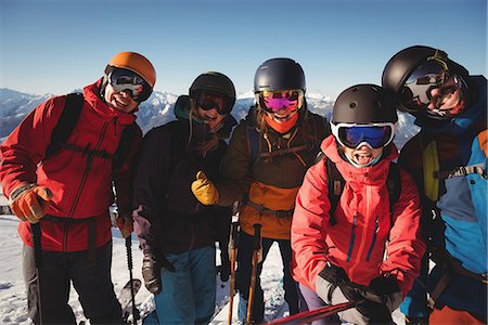 simsearch:6109-06195607,k - Group of skiers having fun in ski resort during winter Photographie de stock - Premium Libres de Droits, Code: 6109-08944927