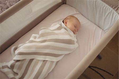 simsearch:632-05553588,k - High angle view of baby sleeping in crib Stock Photo - Premium Royalty-Free, Code: 6109-08945219