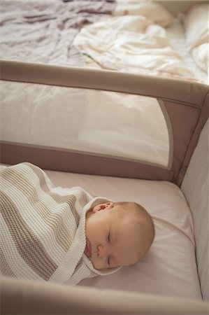simsearch:632-05553588,k - High angle view of cute baby sleeping in crib Stock Photo - Premium Royalty-Free, Code: 6109-08945220