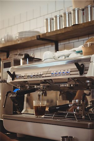 simsearch:6109-08536940,k - Machine making cup of coffee in cafe Stock Photo - Premium Royalty-Free, Code: 6109-08945394