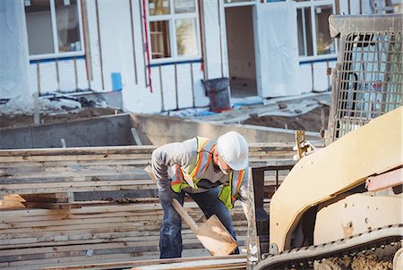 Construction worker working at construction site Stock Photo - Premium Royalty-Free, Code: 6109-08952840