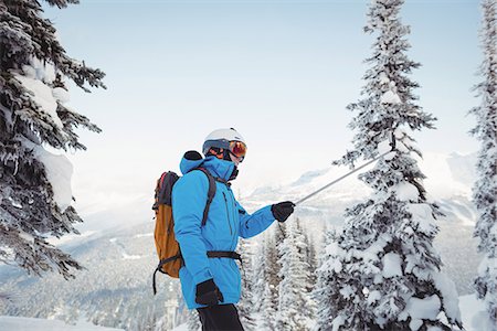 simsearch:6109-08953148,k - Skier taking selfie on snowy mountain Stock Photo - Premium Royalty-Free, Code: 6109-08952946