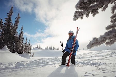 ski trail - Skier walking with ski on snowy mountain Stock Photo - Premium Royalty-Free, Code: 6109-08952953