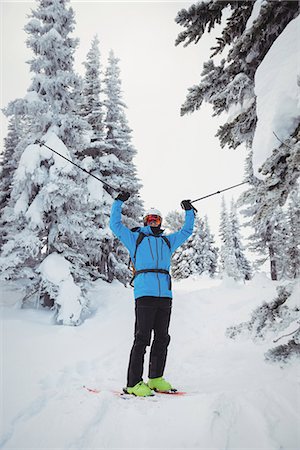 simsearch:6109-08944908,k - Skier standing with ski on snowy landscape Stock Photo - Premium Royalty-Free, Code: 6109-08952962