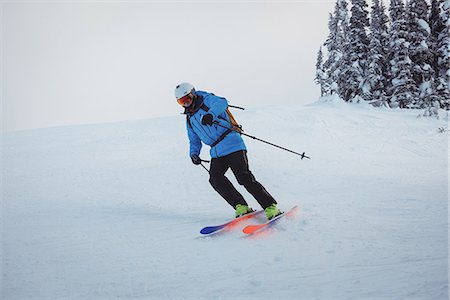 simsearch:6109-08944908,k - Skier skiing on snowy mountains Stock Photo - Premium Royalty-Free, Code: 6109-08952966
