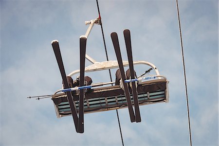 Skiers travelling in ski lift at ski resort Stock Photo - Premium Royalty-Free, Code: 6109-08953144