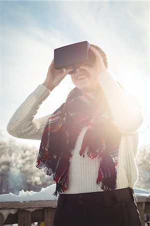 simsearch:6109-08953148,k - Woman in winter wear using VR headset Stock Photo - Premium Royalty-Free, Code: 6109-08953175