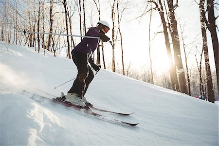 simsearch:6109-06195607,k - Skier skiing on the snow covered landscape Photographie de stock - Premium Libres de Droits, Code: 6109-08953178