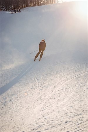 simsearch:6109-08944908,k - Skier skiing on the mountain slope Stock Photo - Premium Royalty-Free, Code: 6109-08953135