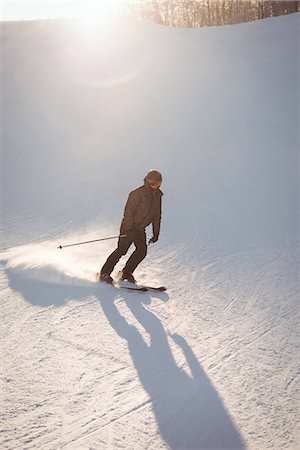 simsearch:6109-08944908,k - Skier skiing on the mountain slope Stock Photo - Premium Royalty-Free, Code: 6109-08953136