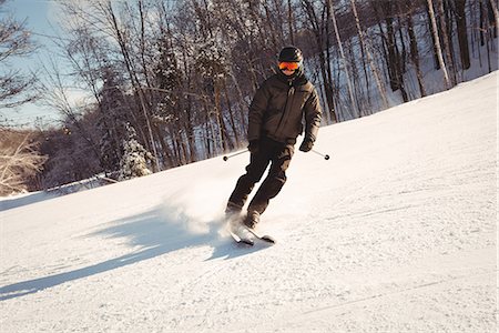 simsearch:6109-08944908,k - Skier skiing on the mountain slope Stock Photo - Premium Royalty-Free, Code: 6109-08953138