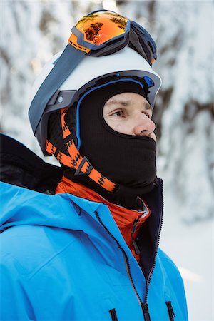 simsearch:6109-08953148,k - Skier standing and looking away on snowy landscape Stock Photo - Premium Royalty-Free, Code: 6109-08953233