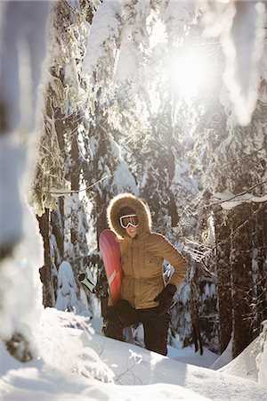 simsearch:649-06844056,k - Woman with snowboard walking on snowy mountain Stock Photo - Premium Royalty-Free, Code: 6109-08953238