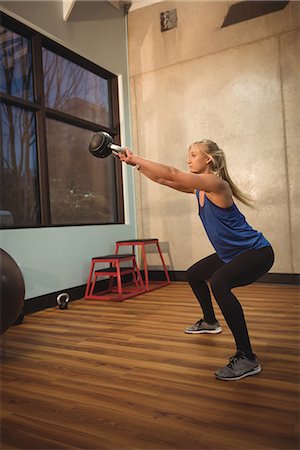 simsearch:6109-08953510,k - Fit woman exercising with kettlebell in the gym Stock Photo - Premium Royalty-Free, Code: 6109-08953486