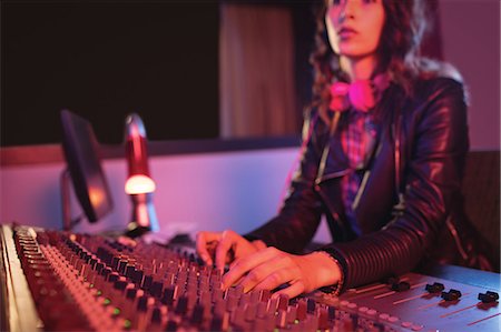 record - Female audio engineer using sound mixer in recording studio Stock Photo - Premium Royalty-Free, Code: 6109-08953687